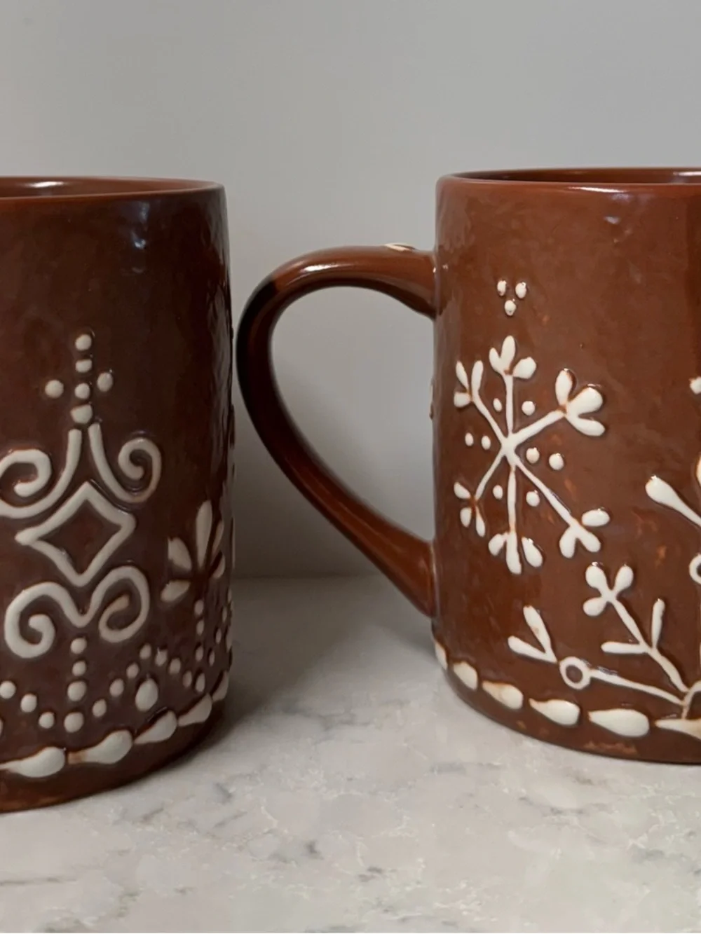 Pottery Barn Brown Ceramic Mug with White Snowflake Design